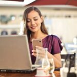 blog image - positive reviews - girl on computer at restaurant